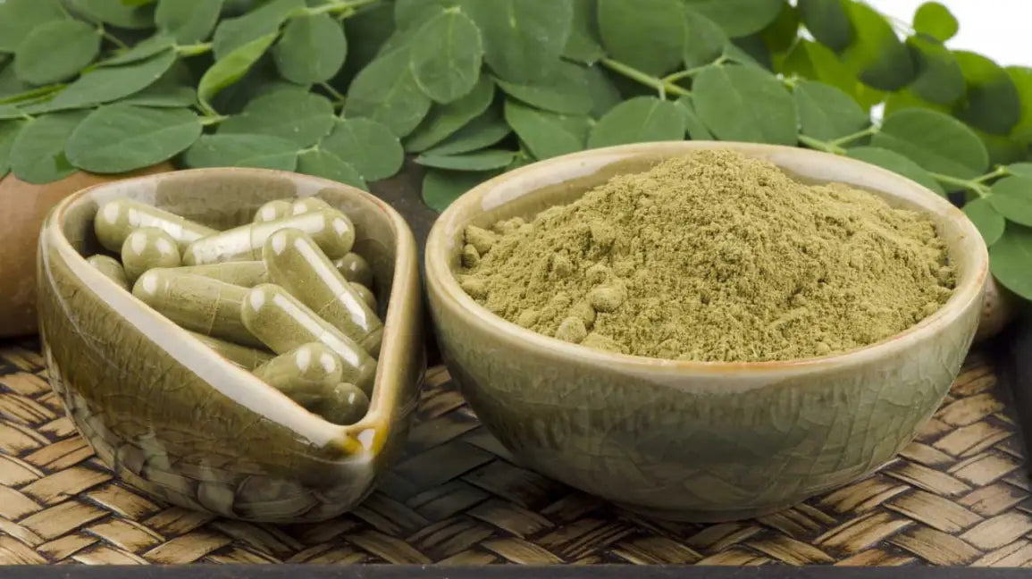 Moringa leaf powder in a wooden bowl — nutrient-dense botanical supplement NZ