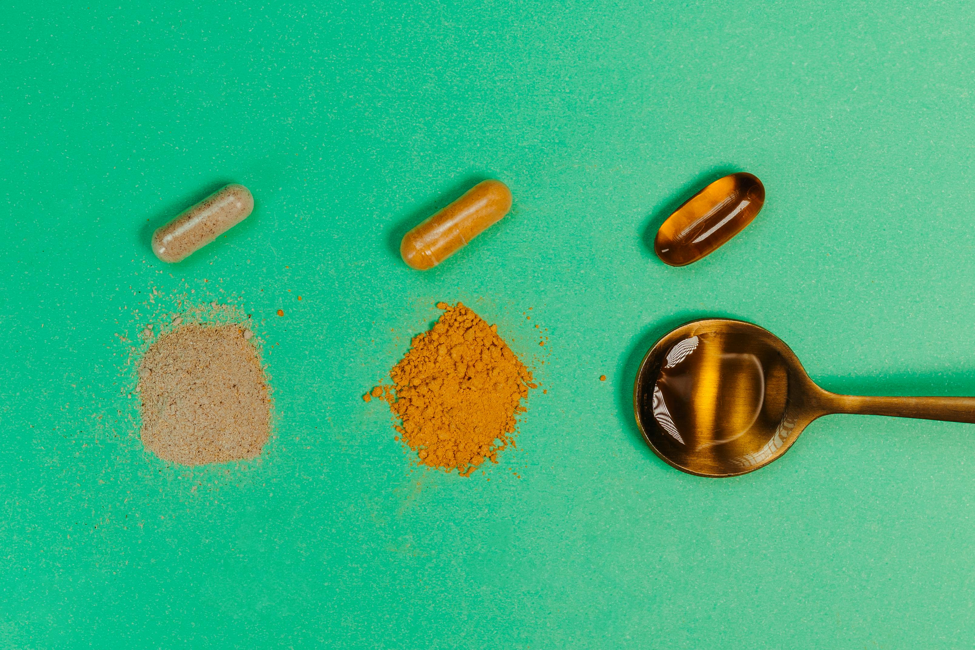 Golden turmeric powder and fresh turmeric root — Ayurvedic spice with curcumin NZ